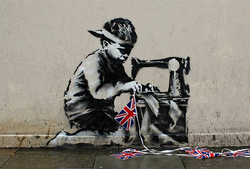 banksy sewing boy
