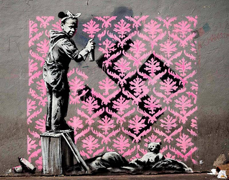 banksy spray painting girl